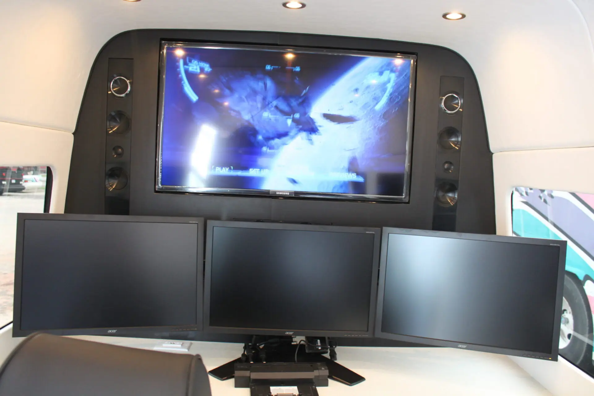 three monitors and one big screen
